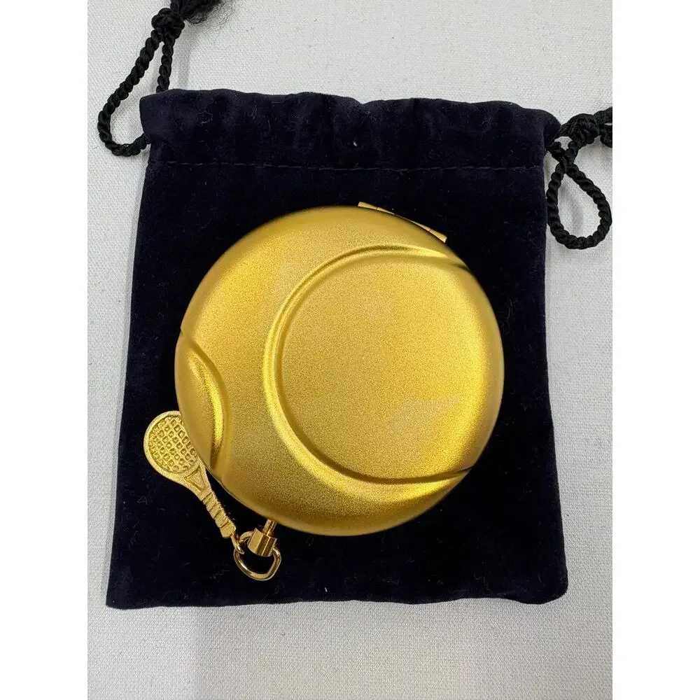 Vtg Estée Lauder Gold Tennis Ball Compact w/ Charm and New powder insert